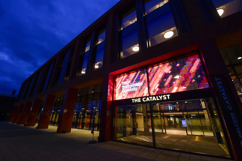 Staffordshire University's Catalyst building lit up with the ted x Staffordshire University branding